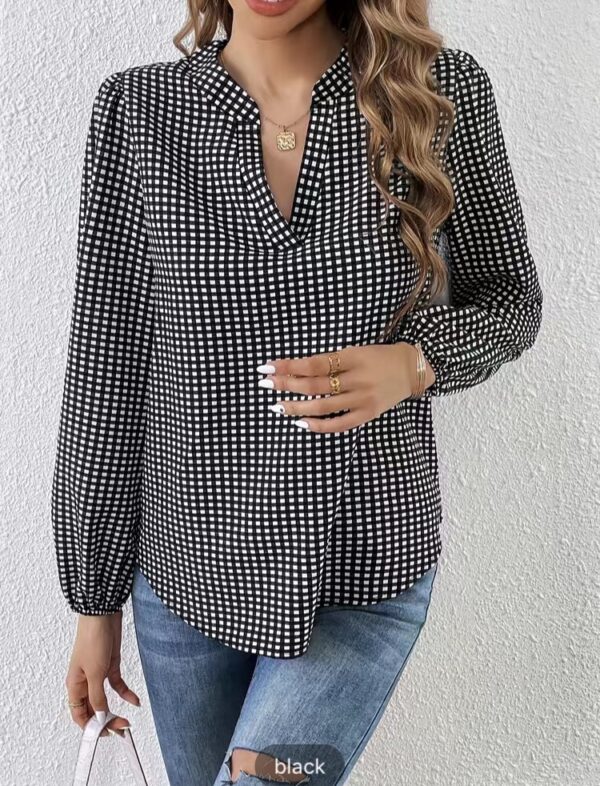 Plaid print V-neck blouse.